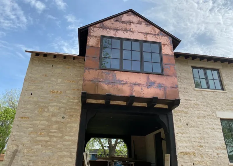 Copper metal panel facade on a stone building for Metal Roof Coating in Fairlawn